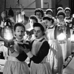nurses singing to patients in hospital, 1940