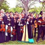 UT Austin mariachi ensemble, performance at the Texas capitol grounds. Zeke is in the back row, third from left.