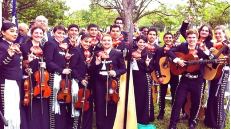 UT Austin mariachi ensemble, performance at the Texas capitol grounds. Zeke is in the back row, third from left.